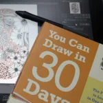 Line & Blossom Design close up of XPPen tablet and Book You Can Draw in 30 Days