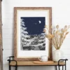 Autumn Before Dawn part of the Vintage Series by Line & Blossom Design framed with a white matte on a side table with decorative items