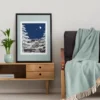 Autumn Before Dawn part of the Vintage Series by Line & Blossom Design framed with a soft blue matte on a table beside a modern sofa