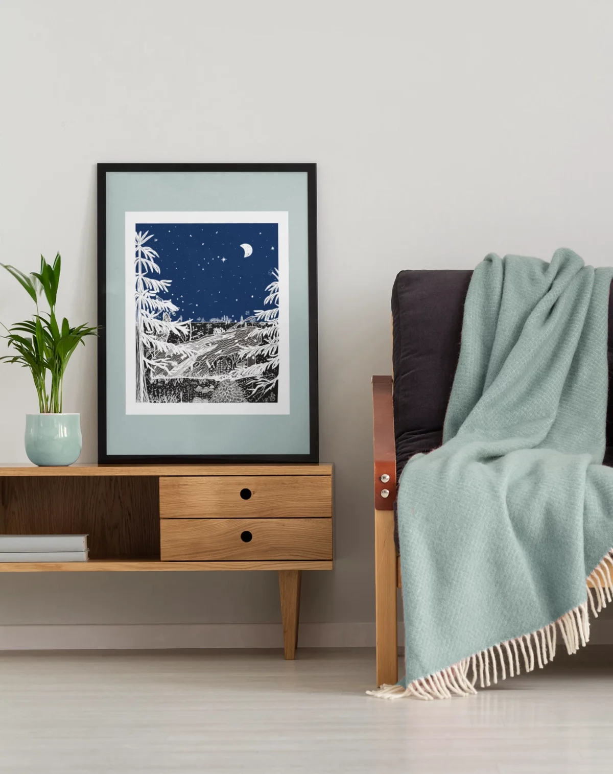 Autumn Before Dawn part of the Vintage Series by Line & Blossom Design framed with a soft blue matte on a table beside a modern sofa
