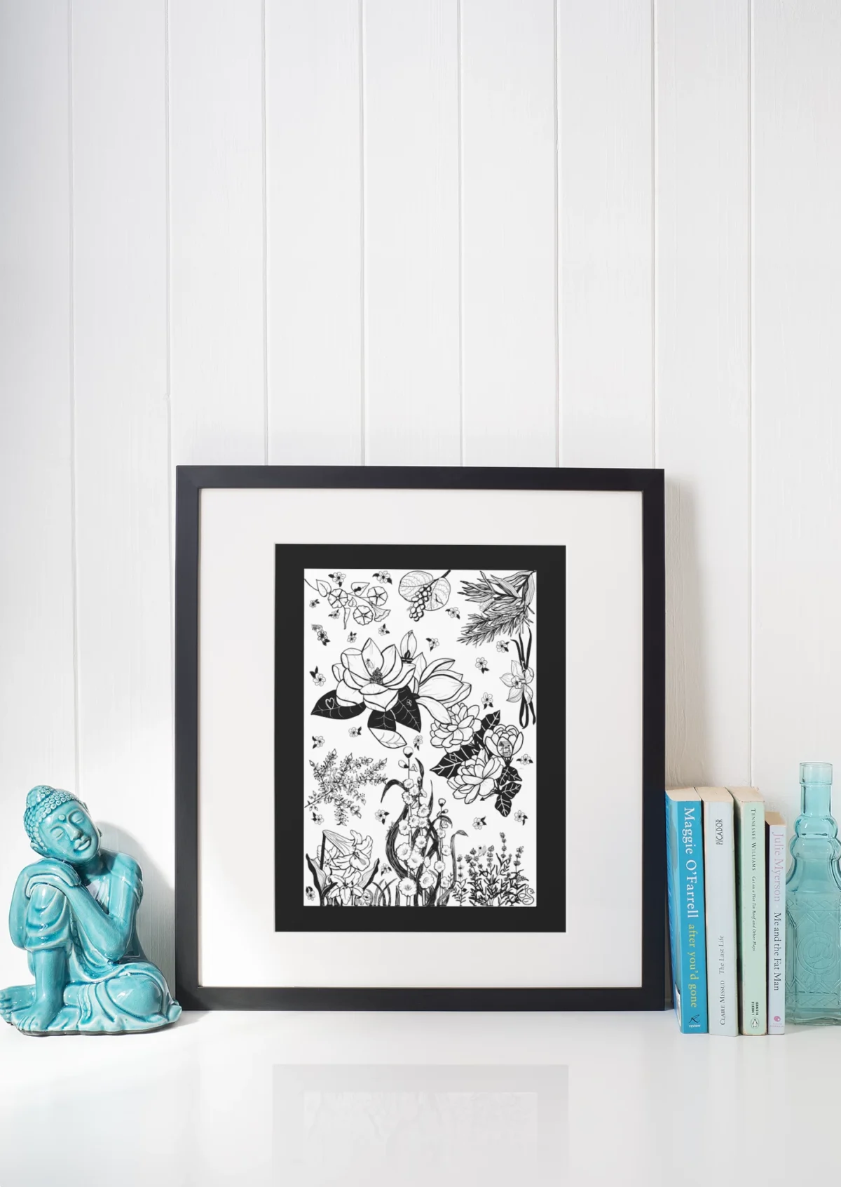 Fragrant Gathering by Line & Blossom Design on a shelf with a Buddha statue and books